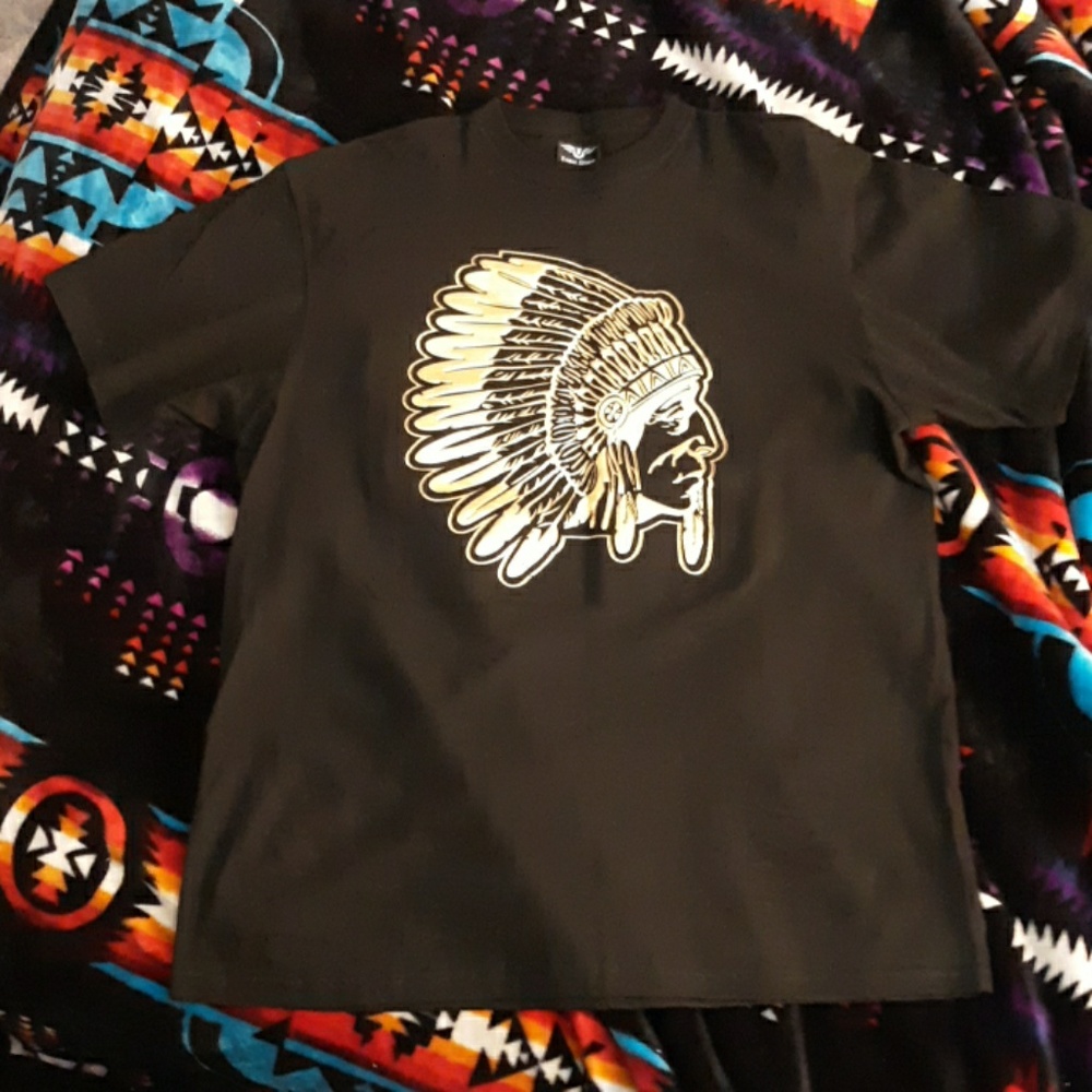 Chief . all black an gold shirt.